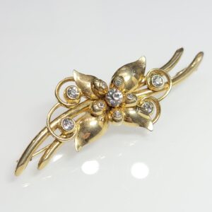 Pozłacana broszka - mosiądz złocony - kwiat cyrkonie