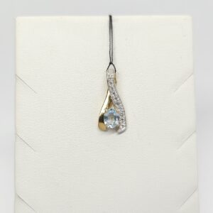 Złoty wisiorek z niebieskim spinelem i cyrkoniami, złoto pr. 0,375